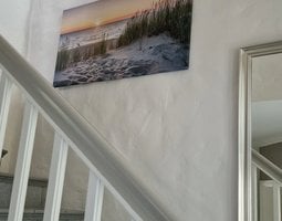 Canvas schilderij Zonsondergang bij duinstrand met helmgras