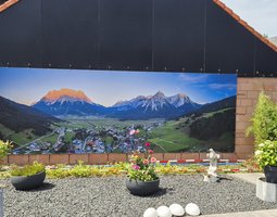 Tuinposter Picturesque mountain village situated in a lush valley surrounded by verdant hills, Lermoos, Tirol