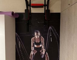 Fotobehang Battle ropes session. Attractive young fit and toned sportswoman working out in fitness  training gym